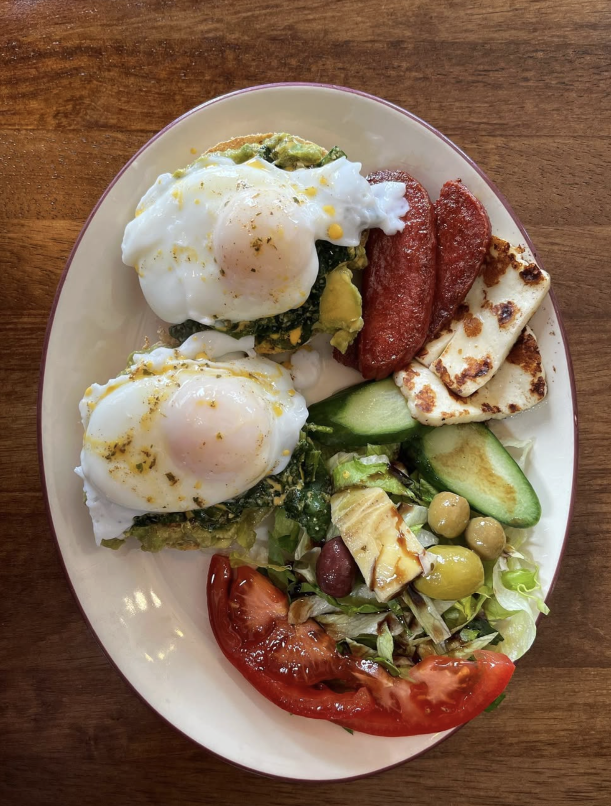 Poached eggs on toast with avocado and halloumi