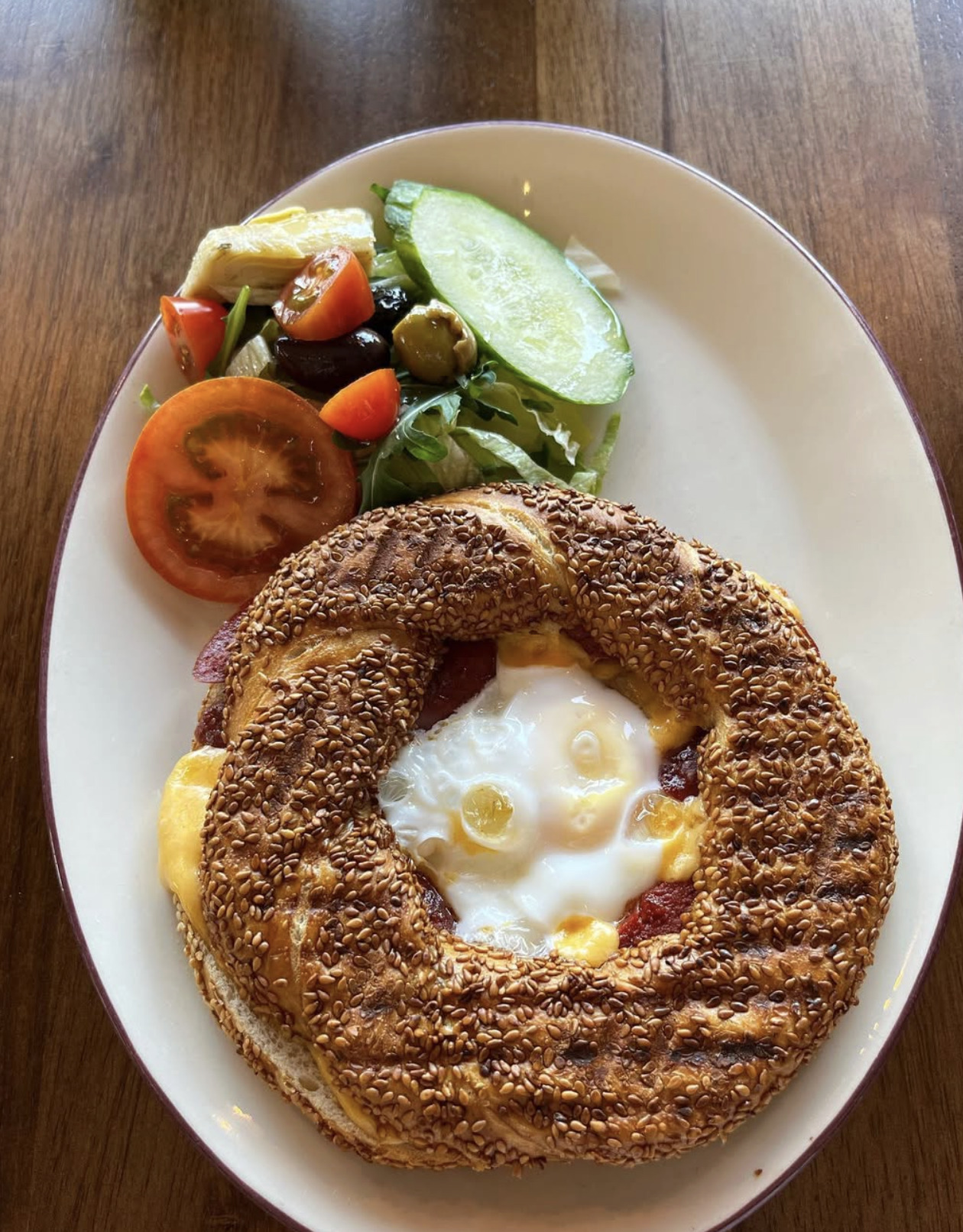 Toasted sesame bagel with fried egg and cheese