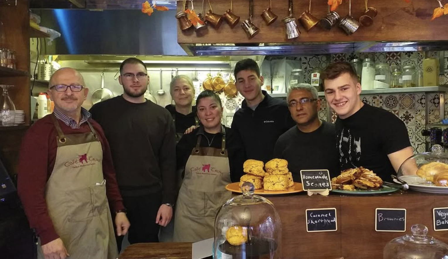 Team behind the counter with pastries